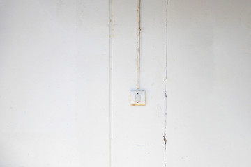 The switch lights installed on the concrete wall of old dilapidated look