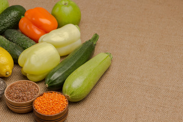 Natural vegetarian source of protein, calcium. Set of balanced nutrition products: chili, pepper, lemon, apple, avocado, burlap, lentils, flax seed, kinoe, chickpeas..