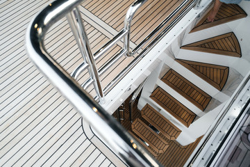 luxury yacht exterior: Wooden deck and steps flooring. - obrazy, fototapety, plakaty