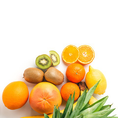 Assortment of tropical fruits, group of orange, kiwi, tangerine, lemon, grapefruit isolated on white background, top view