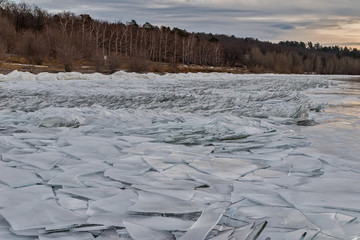 Ice hummocks on the river. A lot of cracked ice