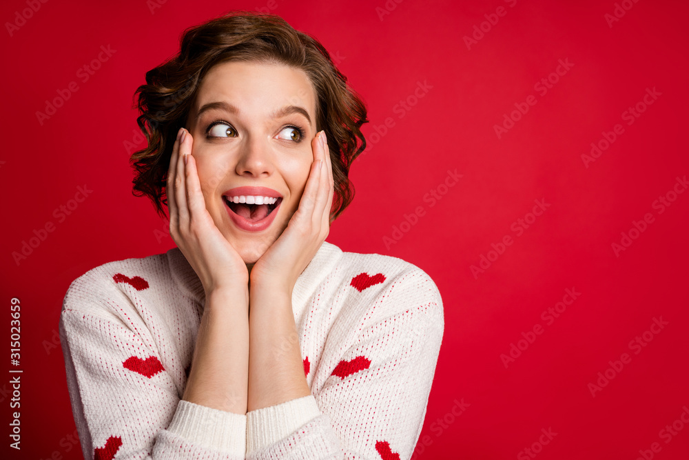 Wall mural Close up photo of funny crazy astonished girl look incredible romantic information impressed scream wow omg touch face hands cheeks isolated over shine color background