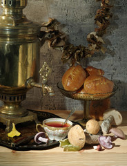 Rustic still life with samovar, mushrooms and pies