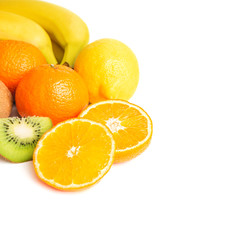 Group of tropical fruits, sliced halves of orange and kiwi isolated on white background