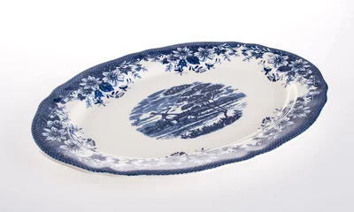 Rollo plate or hand painted plate on a background new. © heinteh