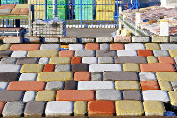 Bricks and tiles of pavement  at construction site. Warehouse paving slabs for laying road. Construction of sidewalks.