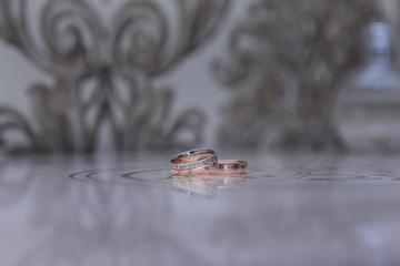 a pair of gold wedding rings of the bride and groom