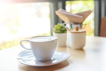 hot coffee on table / hot cappuccino with nice pattern milk foam 