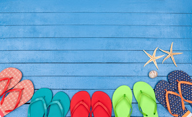 flip flops on wooden blue table