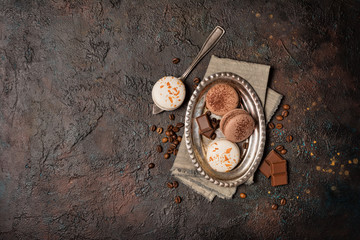 French macaroons with different flavors on vintage silver tray