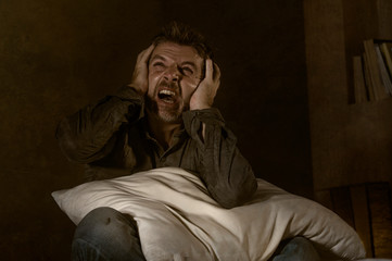dramatic portrait of depressed and sick man suffering from psychosis illness or mental disorder...