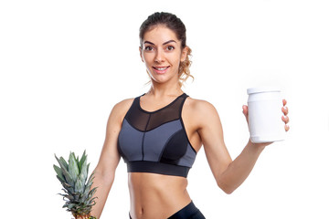 woman athlete holding a white container in her hands