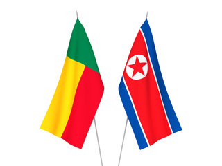 National fabric flags of Benin and North Korea isolated on white background. 3d rendering illustration.