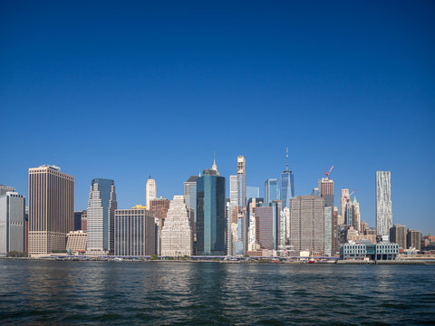 Downtown Manhattan island, New York City, United States of America : [ Hudson river view and helicopter aerial look on the city skyline buildings ]