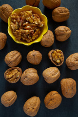walnuts on black stone surface