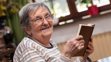 Old woman reading a book