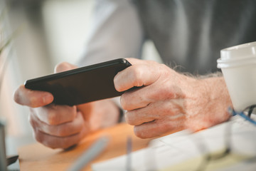 Hands using mobile phone