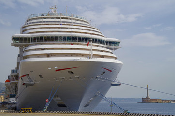 Gigantic modern cruise ship liner in the port of Messina in Italy close to Taormina during...