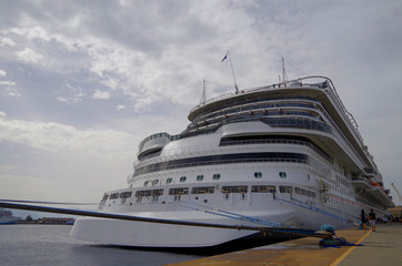 Gigantic modern Carnival cruise ship liner or cruiseship in the port of Messina in Italy close to...