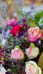 a bouquet of red white flowers of red and pink roses