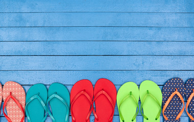 flip flops on wooden blue table