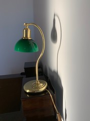 Antique green lamp on the writing desk