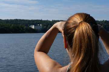 Woman gazing at the castle in the distance