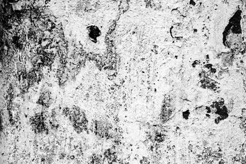 Texture of a concrete wall with cracks and scratches which can be used as a background