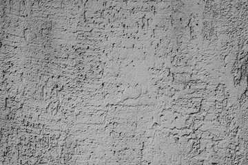 Texture of a concrete wall with cracks and scratches which can be used as a background