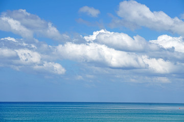 Nature seascape of Clouds blue sky and blue sea at Mai Khao beach near Phuket airport  thailand - Blue nature backdrop background with copy space text