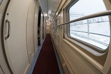 Obraz premium The corridor of the long-distance train. New modern double-decker train. Touristic and travel concepts. Fish eye lens.