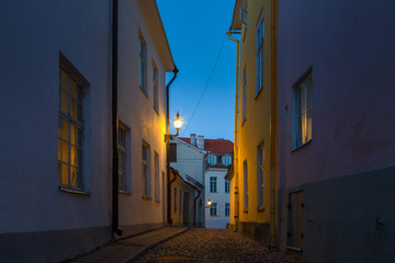 Fototapeta na wymiar Narrow street in the Old Town of Tallinn, Estonia, night time