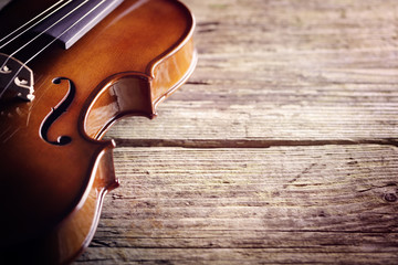 Violin on wood background