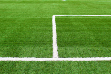 Obraz premium Artificial grass on the football field. Close-up. Background. Texture.