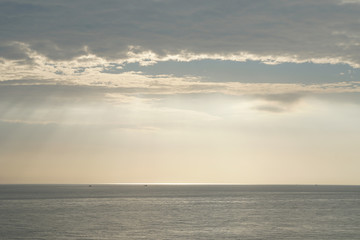 Nature seascape of Tranquil scene Light passing through the clouds on sunset over the ocean at phuket Thailand. Blue nature backdrop background with copy space text concept 