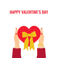 Hands holding red gift in the form of heart with yellow bow on white background