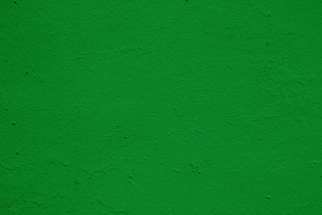 Texture of unevenly painted green wall.