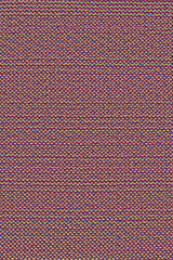 Texture of rough red and yellow fabric with a seam in a line. Cloth background with smooth lines.