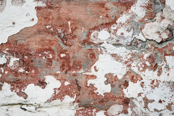 Natural destroyed stone surface. Vintage rustic pattern. Brown background. Old shabby cracked stucco. Dirty wall, grunge texture. Painted concrete, abstract damaged architecture backdrop.