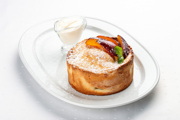 Homemade pie with whole plums from shortbread-almond dough.