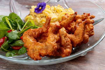 Frog legs crispy with mashed potatoes. Classic retro Russian dish