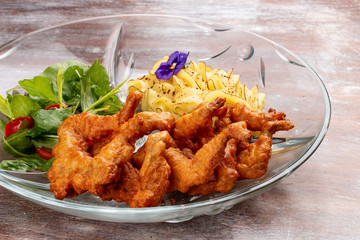 Frog legs crispy with mashed potatoes. Classic retro Russian dish