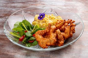 Frog legs crispy with mashed potatoes. Classic retro Russian dish