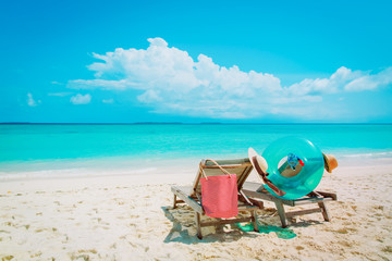 Two beach chairs on tropical vacation, travel to sea