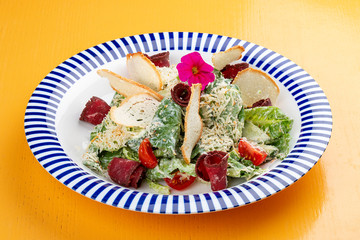 Caesar salad in Georgian with basturma and smoked Suluguni.