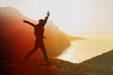 Fototapeta na wymiar happy tourist enjoy hiking in sunset mountains