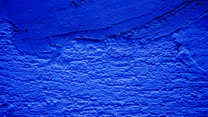 Naklejka premium Blue concrete wall covered with cement.