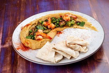 Hummus with shrimp, vegetables and homemade tortillas