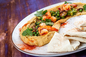 Hummus with shrimp, vegetables and homemade tortillas