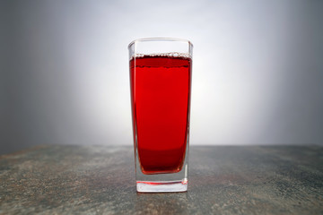 Silver colored bottle opener on black background. Universal shiny corkscrew tool with spiral for opening beverage drinks isolated on dark backdrop with space for text